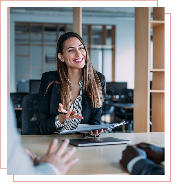 Smiling woman in office meeting room.