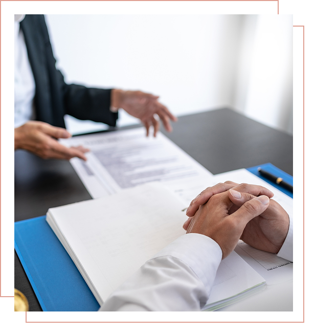Business meeting with documents on table.