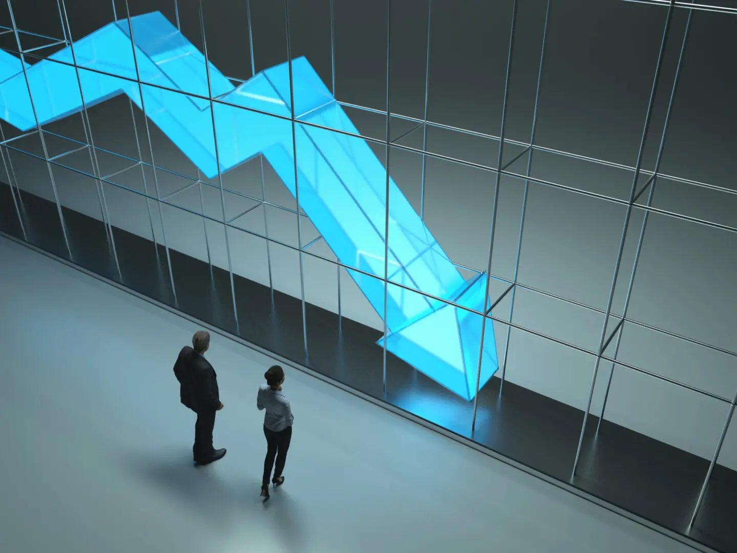 People observing large downward arrow graph.