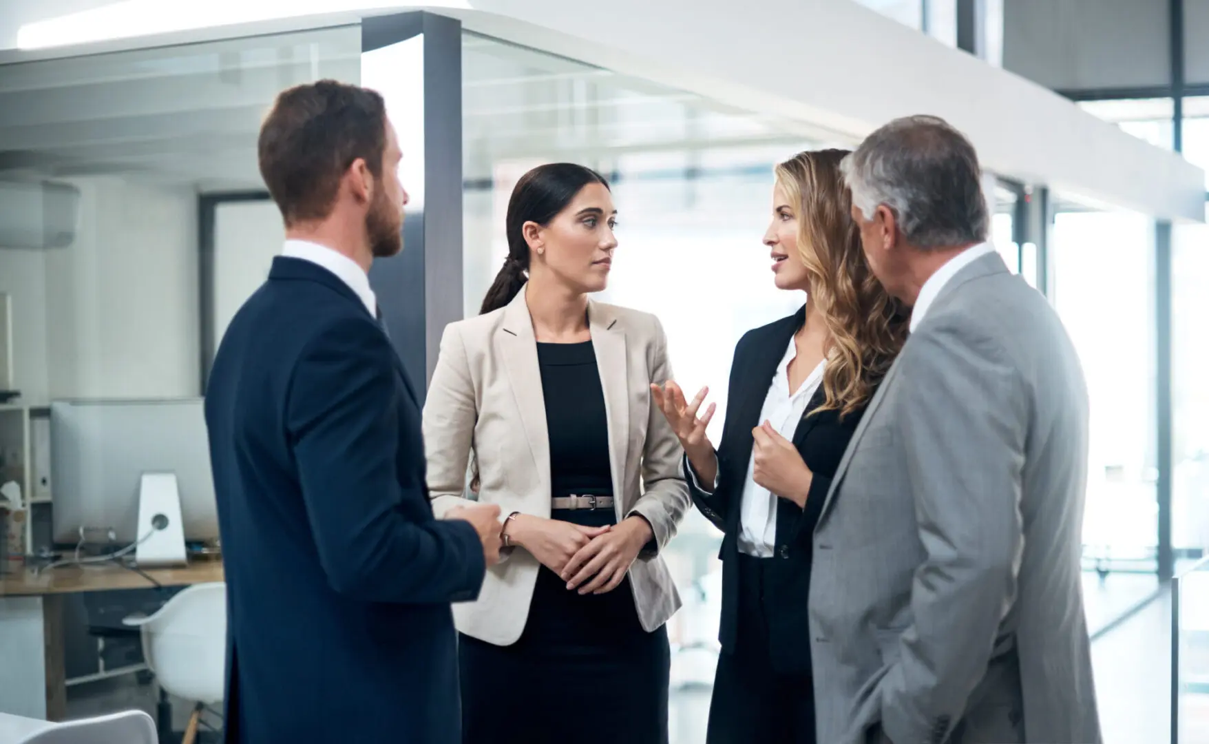 Business professionals having a discussion in office.