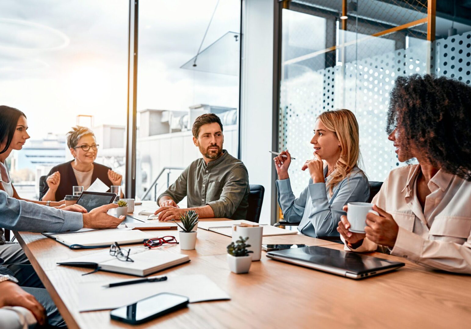 People in a meeting at a table.